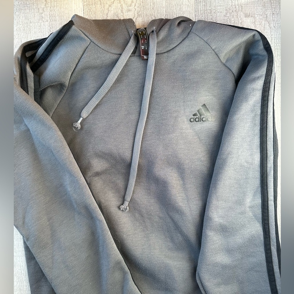 Adidas sweatshirt gray and black stripes. Piling & fraying at the drawstrings.